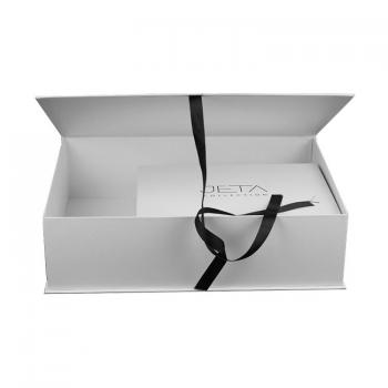 White book style box with ribbon