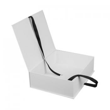 White book style box with ribbon