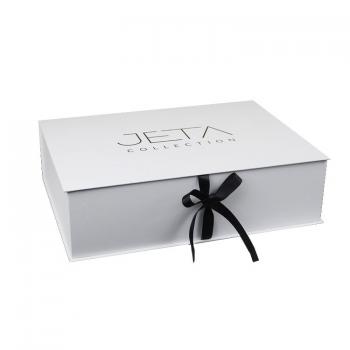 White book style box with ribbon